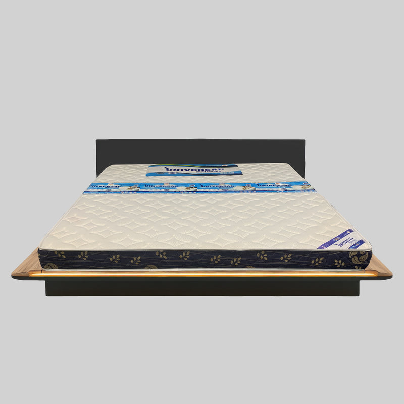Mattress on a bed frame with 'Universal' branding on a gray background