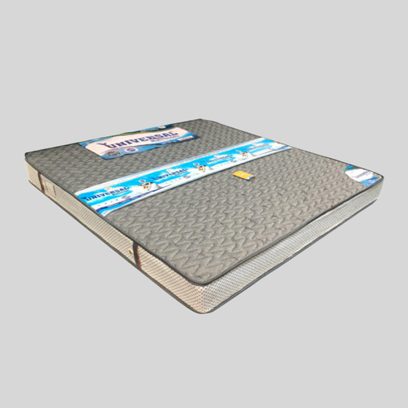 Gray mattress with 'Universal' branding on a gray background
