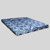 Mattress with blue and gray pattern on a light gray background