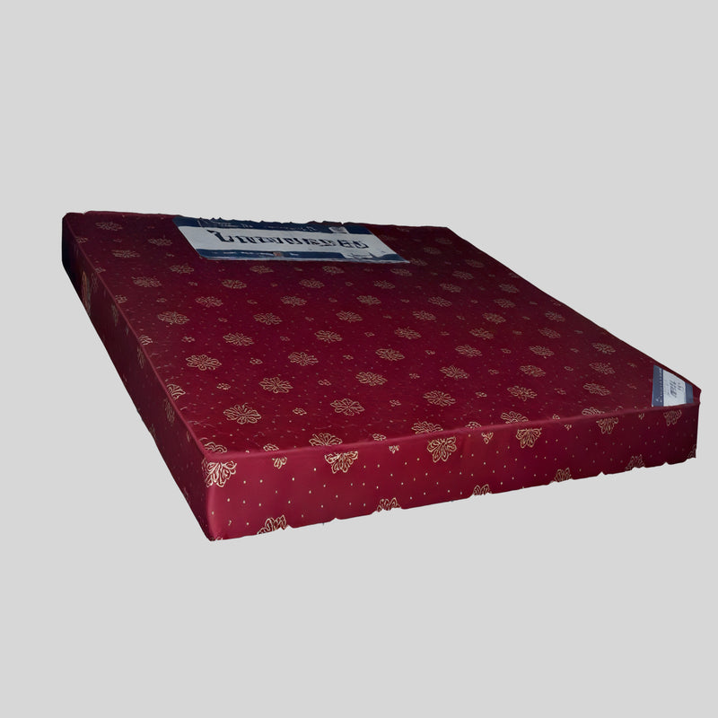 Red mattress with gold patterns on a gray background