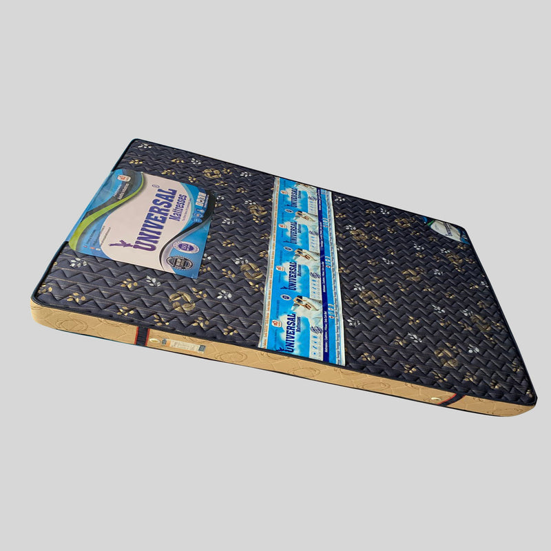 Decorative bed with tufted headboard and white mattress displaying 'Universal Mattress' logo on a gray background.

