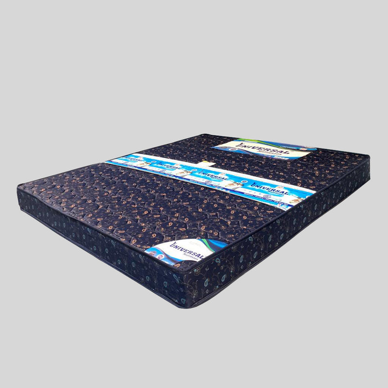 Blue mattress with a brand label on a gray background