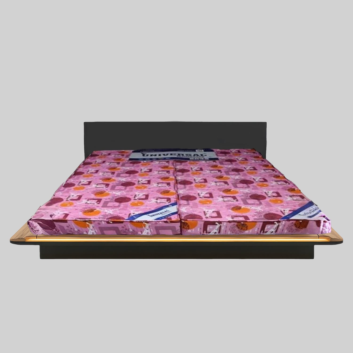 Pink mattress with a pattern on a gray background