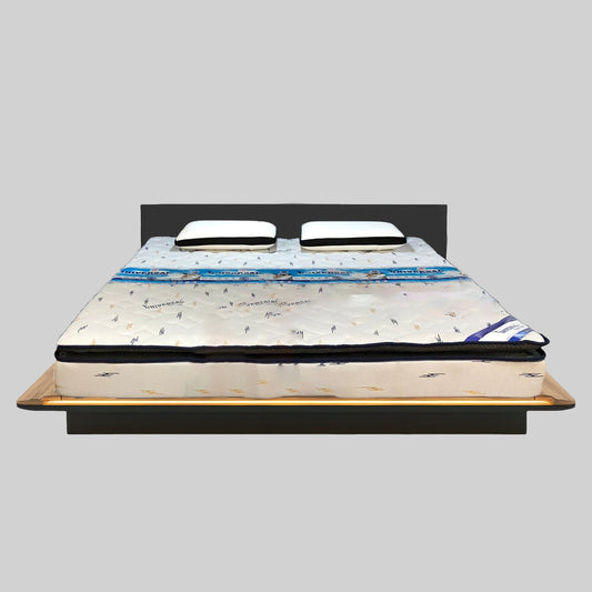 Bed with a mattress on a gray background