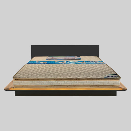 Mattress on a bed frame with a gray background