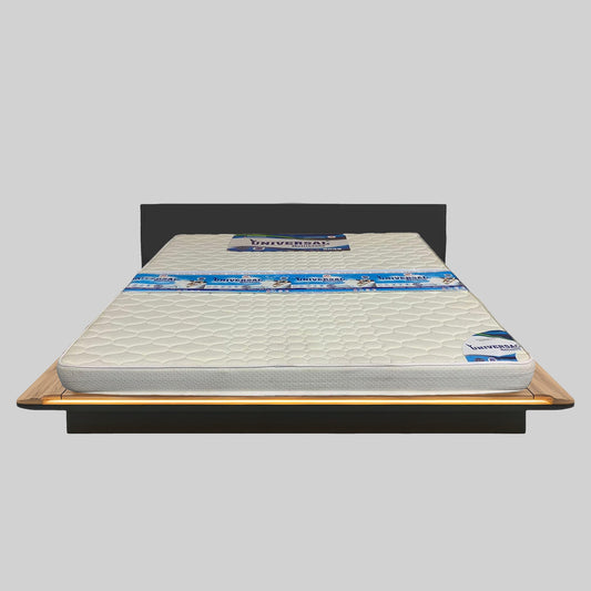 Mattress on a bed frame with 'Universal' branding on a gray background