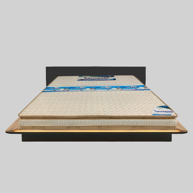 Mattress on a bed frame with 'Universal' branding on a gray background