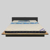 Mattress on a bed frame with 'Universal' branding on a gray background